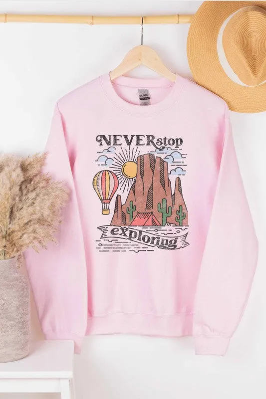 NEVER STOP EXPLORING GRAPHIC SWEATSHIRT